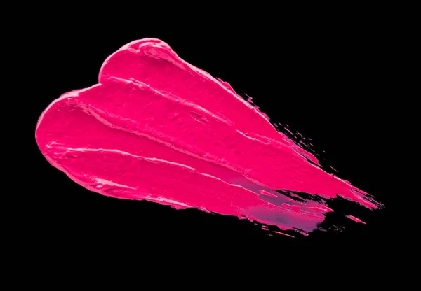 Lápiz labial manchado rosa sobre un fondo negro aislado —  Fotos de Stock