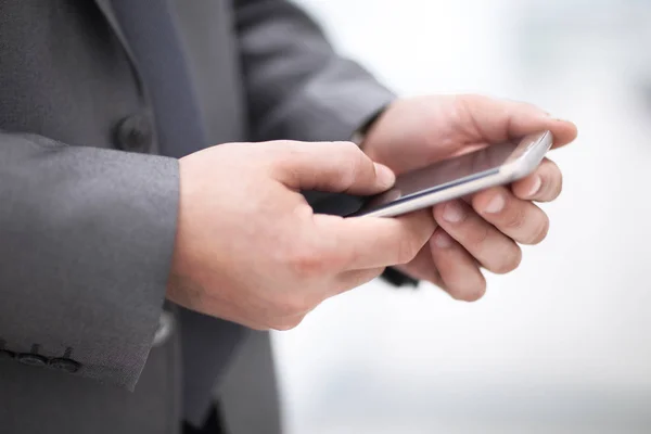 Mock up of a man holding device and touching screen