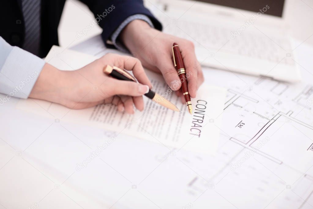 Woman hand signing a contract