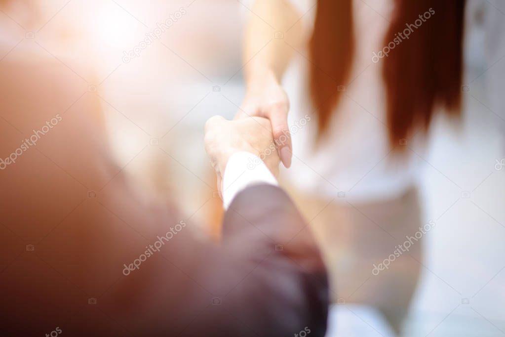 Two confident business man shaking hands during a meeting in office, success, dealing, greeting and partner concept.