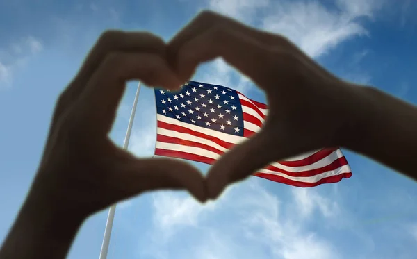 Handen tonen hart tegen Amerikaanse vlag — Stockfoto