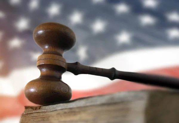 Gavel on book and American flag — Stock Photo, Image