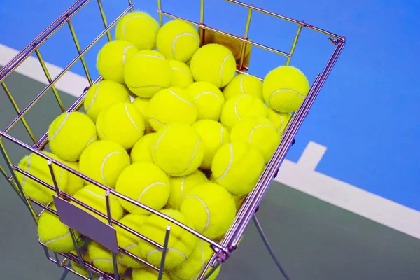 Tennis court with a ball basket — Stock Photo, Image