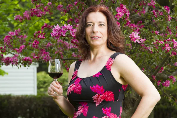 Mature woman with a glass of wine — Stock Photo, Image