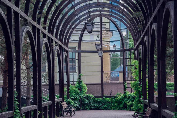 stock image metal arches with lanternes in the park