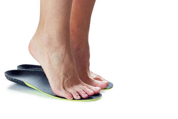 Feet and orthopedic insoles — Stock Photo, Image