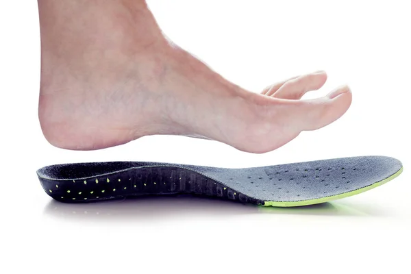 Orthopedic insole and female leg — Stock Photo, Image