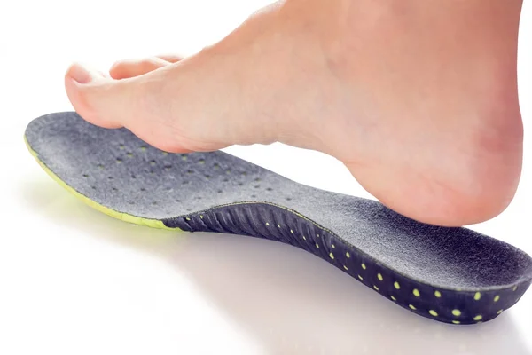 Orthopedic insole and female leg — Stock Photo, Image