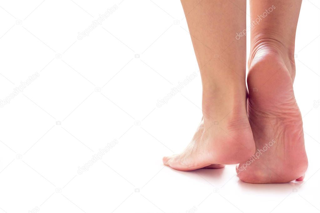 female feet stand on toes 