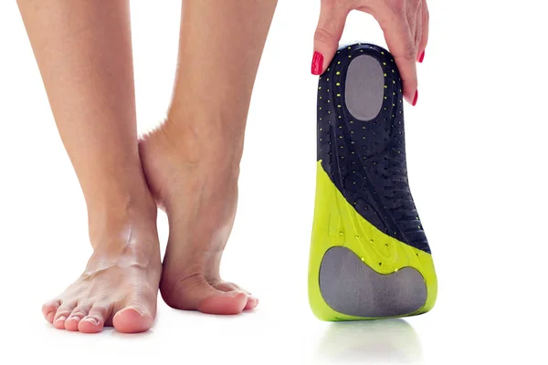 Feet and orthopedic insoles — Stock Photo, Image