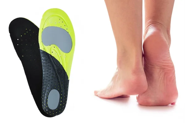 Feet and orthopedic insoles — Stock Photo, Image