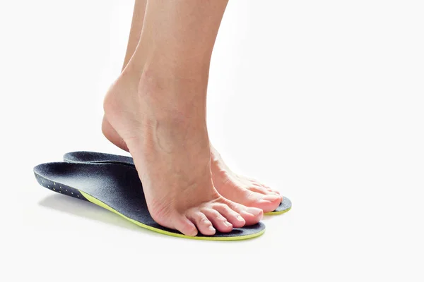 Feet and orthopedic insoles — Stock Photo, Image