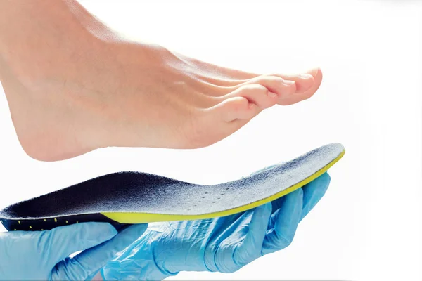 Orthopedic insole in the hands — Stock Photo, Image