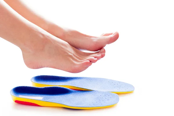 Orthopedic insoles and female legs — Stock Photo, Image