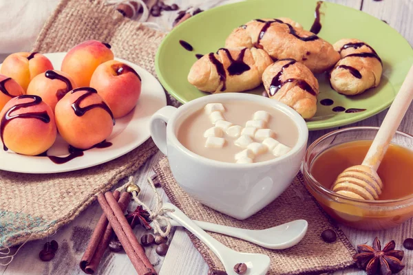 https://st3.depositphotos.com/1033229/i/600/depositphotos_160852142-stock-photo-breakfast-of-coffee-croissants-apricots.jpg