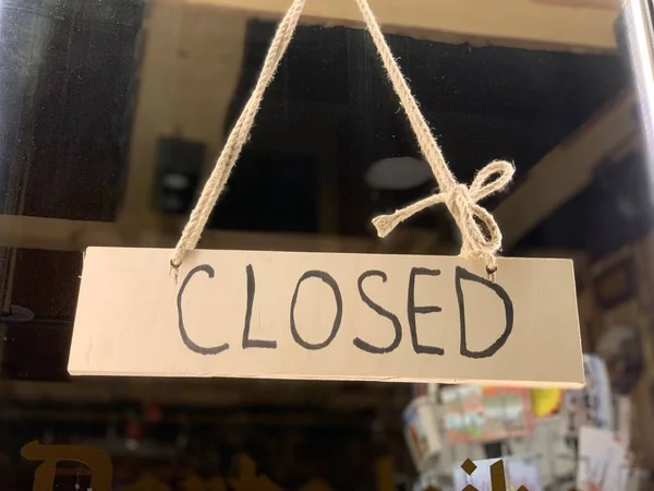 CLOSED shop sign at a shop window in Eastern Europe Latvia Riga — Stock Photo, Image