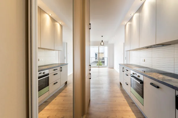 Empty room with domestic kitchen — Stock Photo, Image