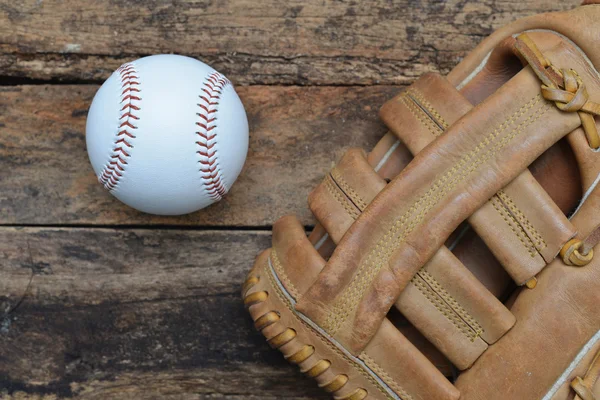 Baseball ball on wooden background.