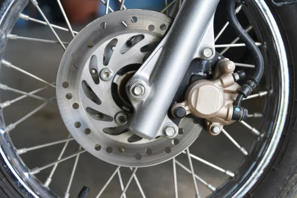 Detail of a motorcycle's front wheel — Stock Photo, Image