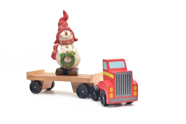 Sneeuwpop en speelgoed vrachtwagen auto — Stockfoto