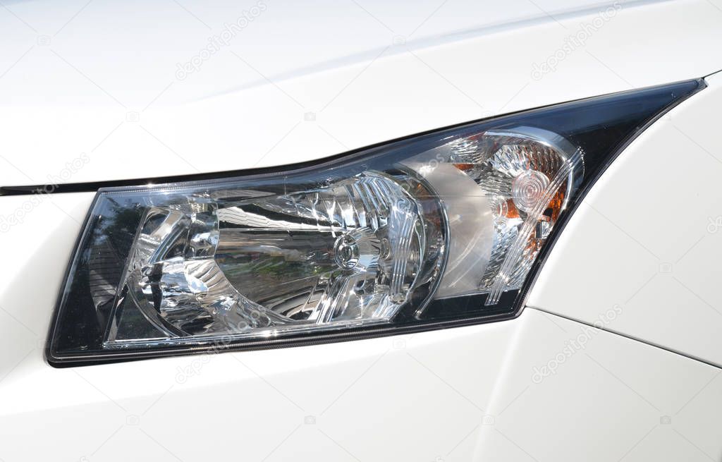 Closeup headlights of car.