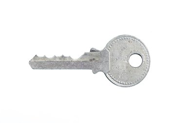  Small key isolated on white  clipart