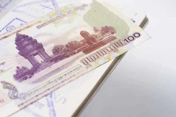 Thai passport with Cambodia money — Stock Photo, Image