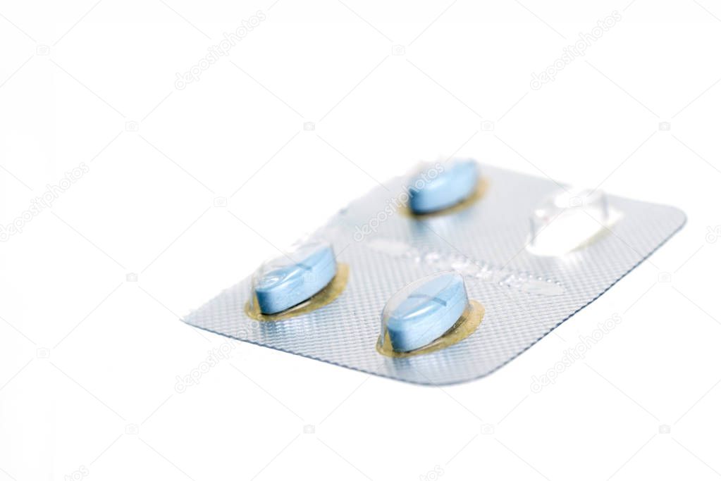 blue pills on white background