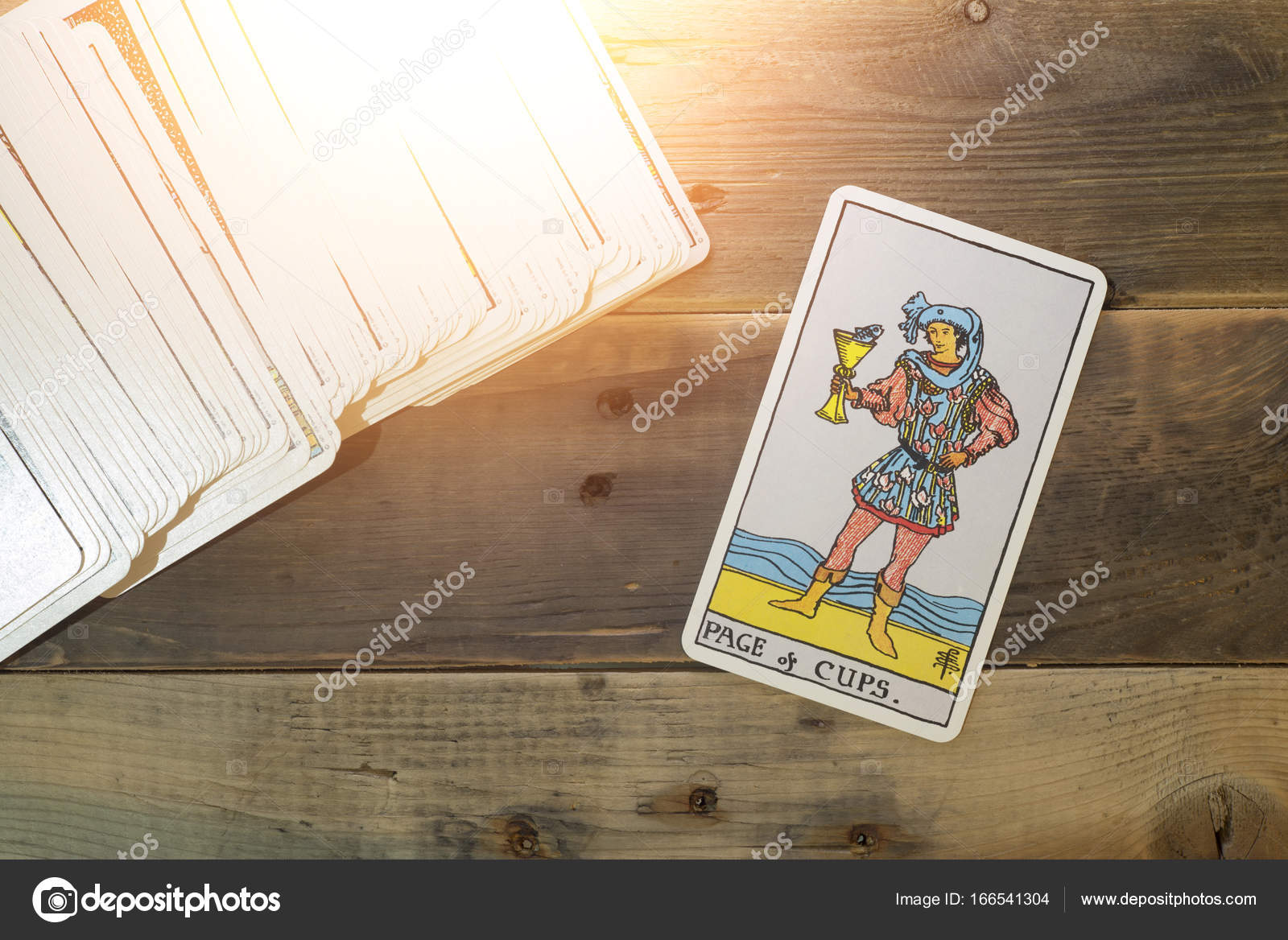 Tarot Cards, the Nine Cups Card on the Front. Tarot Deck Editorial
