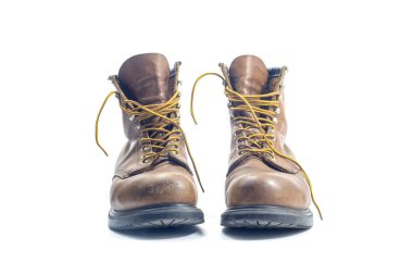 A pair of well worn Work Boots. clipart