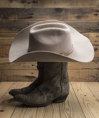 Kovboy çizme ve ahşap zemin üzerine Batı hat.