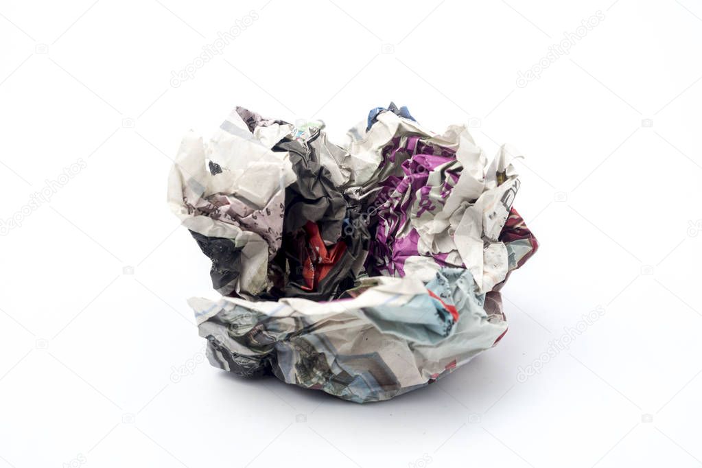 Crushed Newspaper ball isolated on white background.