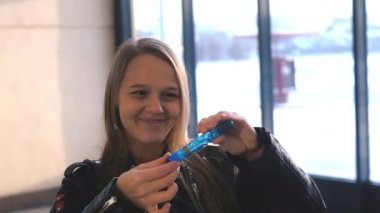 Beautiful Girl Blowing Soap Bubbles.Woman Having Fun.Girl Enjoying .Cheerful Blonde Woman Blowing Soap Bubbles.