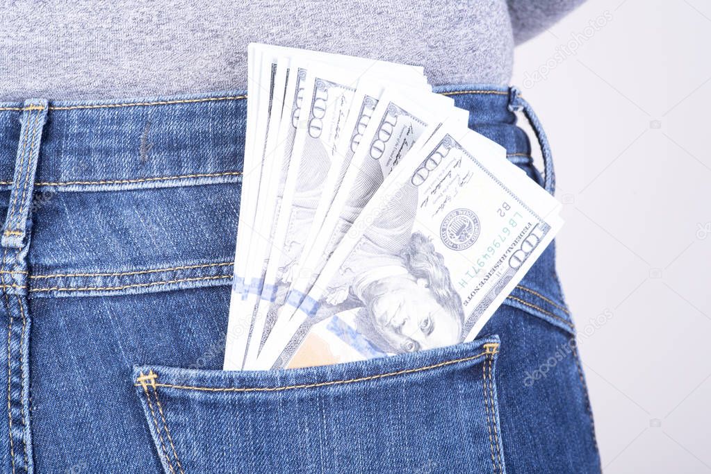 dollars sticking out of his pants pocket