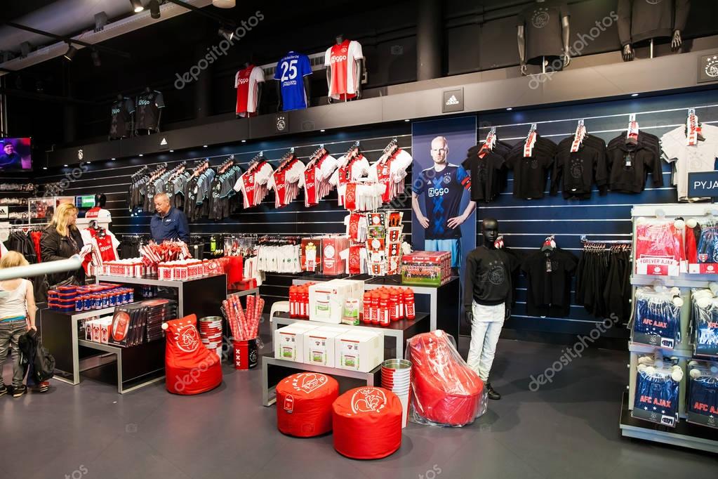 Amsterdam, Netherlands - April, 2017: Ajax fotball club fan shop interior on Amsterdam Arena, Netherlands
