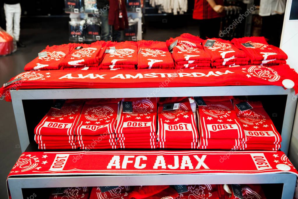 Amsterdam, Netherlands - April, 2017: Ajax fotball club shop interior on Amsterdam Arena, Netherlands. Soccers fan scarves selling