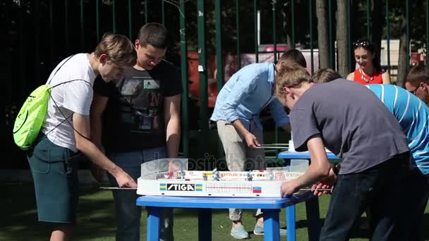 Boys playing table hockey game — Stock Video