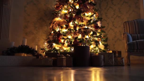 New Year background with presents and flashing garland on the tree — Stock Video