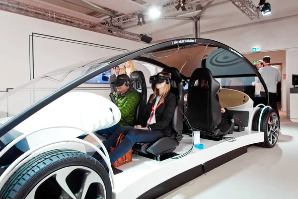 Visitors in virtual glasses headset testing Vodafone 5G-based communications systems for vehicles on exhibition Cebit 2017 in Hannover Messe, Germany — Stock Photo, Image