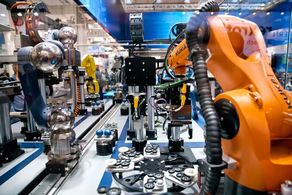 Schunk assembly electronics line with robots on Messe fair in Hannover, Germany Stock Picture