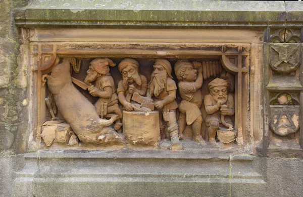 Relief gnomes butchers/Cologne, Germany, August 2017. Relief gnomes butchers. Fragment of the Dwarf Fountain in Cologne. The fountain was created in 1899, by sculptors, father and son, Edmund and Henry Renard.