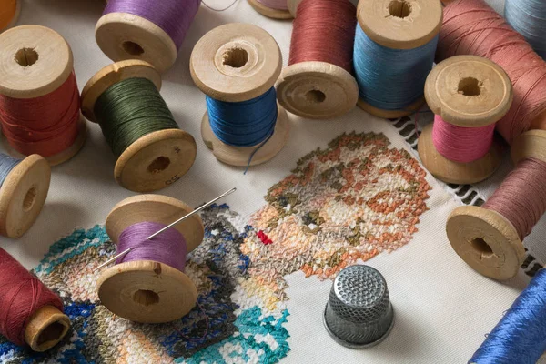 Embroidery, threads, needle and thimble — Stock Photo, Image