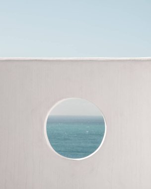 Wall with hole water and blue sky background. Creative, minimal, styled concept for bloggers. clipart