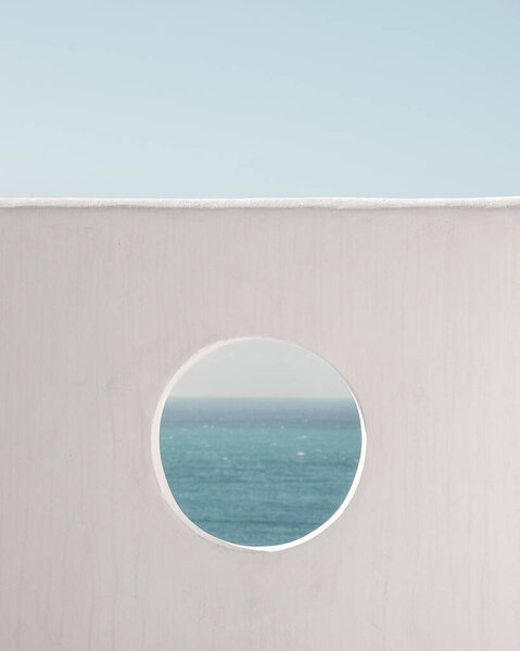 Wall with hole water and blue sky background. Creative, minimal, styled concept for bloggers.