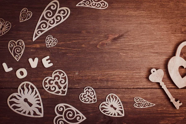 Hearts on a wooden background — Stock Photo, Image