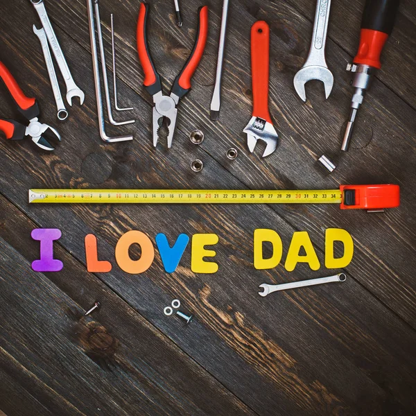 Letters and tools wooden background fathers day — Stock Photo, Image