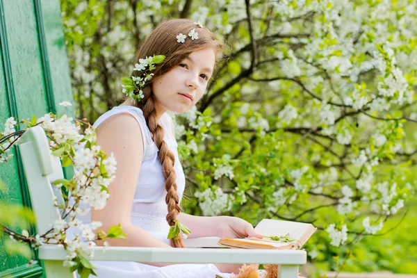 Girl flowered garden cherry — Stock Photo, Image