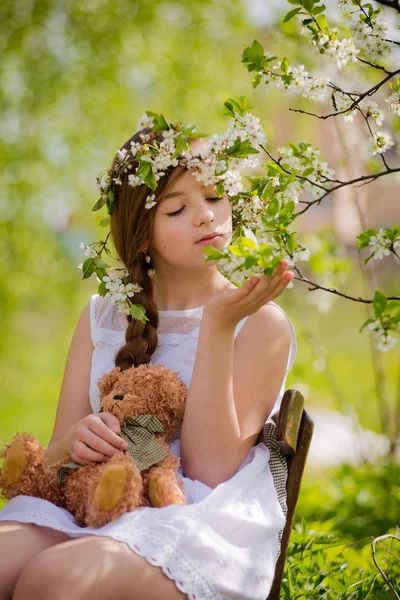 Girl flowered garden cherry — Stock Photo, Image