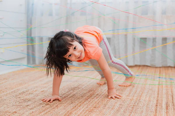 Little Girl Child Climbs Rope Web Game Obstacle Quest Indoors — Stock Photo, Image