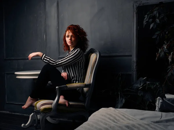 Ginger girl sitting at home — Stock Photo, Image